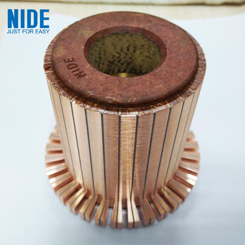 What is the role of the commutator in a DC motor?